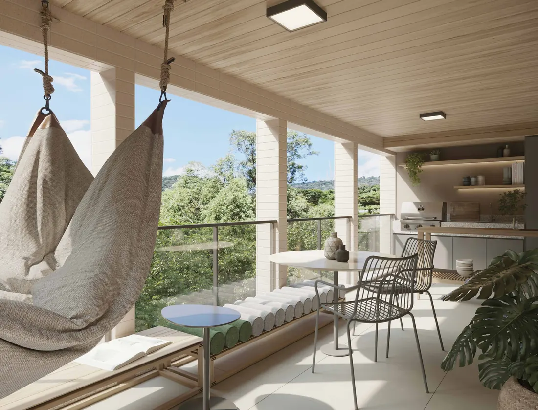 Varanda gourmet de apartamento do Tiê Residencial com redes, bancada e vista para o verde da Tijuca