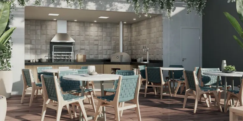 Churrasqueira com forno de pizza do Tiê Residencial, sob pérgola com vegetação