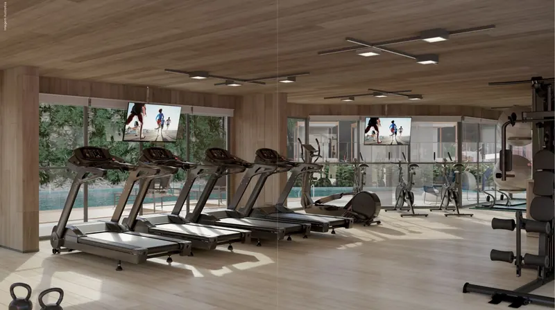 Fitness do Tiê Residencial com esteiras de frente para a piscina